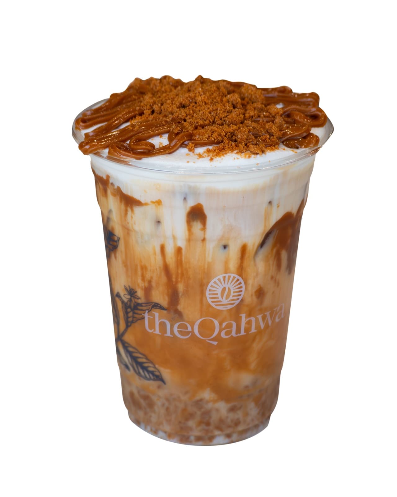 Iced Biscoff Latte in a clear theQahwa cup — espresso and milk swirled with cookie butter over ice, topped with whipped cream, a Biscoff drizzle, and crumbled cookie.