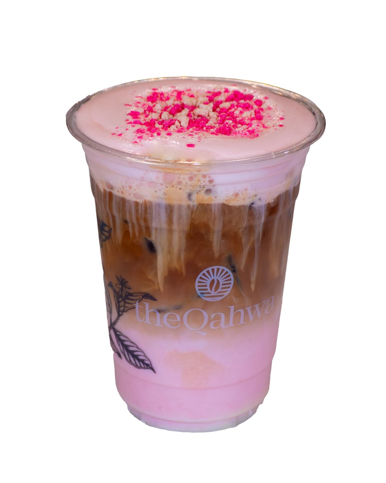 Iced Shortcake Latte in a clear theQahwa cup — espresso and strawberry cream layered over ice, topped with a pink shortcake foam and red sprinkles.
